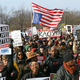Demonstrators hold signs and chant in Freedom Square in Washington, D.C.
Nicole L. Cvetnic/The Root